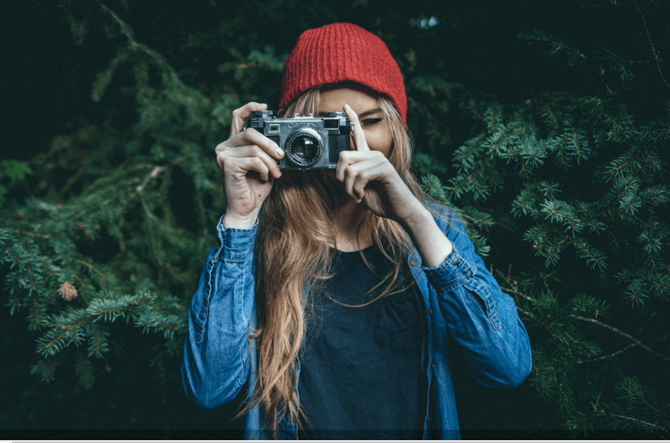 girl holding camera