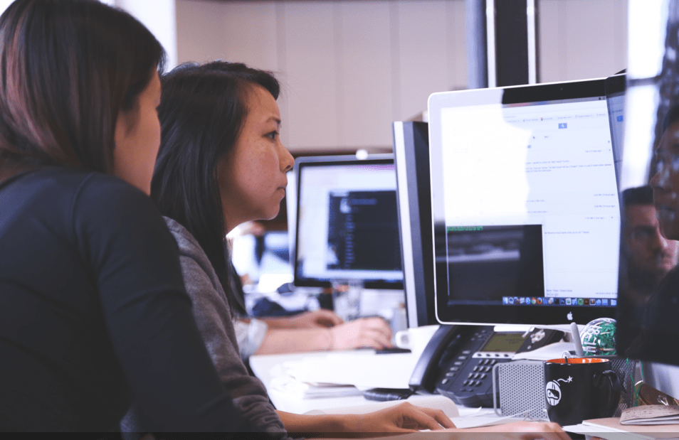 two ladies on a computer