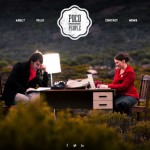 two people seated outside