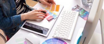 Young Handsome Graphic designer using graphics tablet to do his
