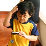 boy confuse choosing items