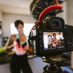 Social media influencer recording video for blog